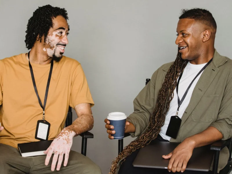 Two colleagues chatting during a coffee break