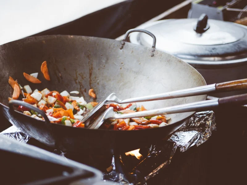 Colourful vegetables cooking in a wok